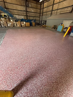 Close-up of decorative flake concrete floor coating